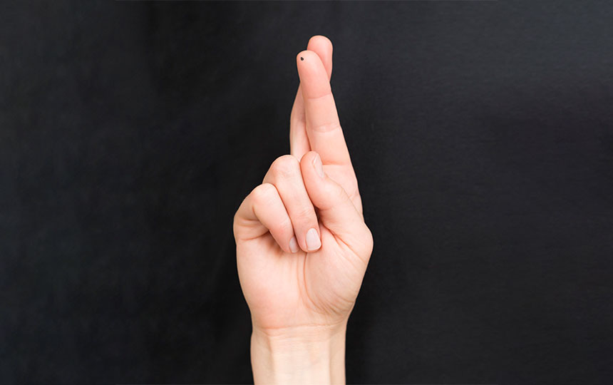 What does a mole on the tip of your finger mean?